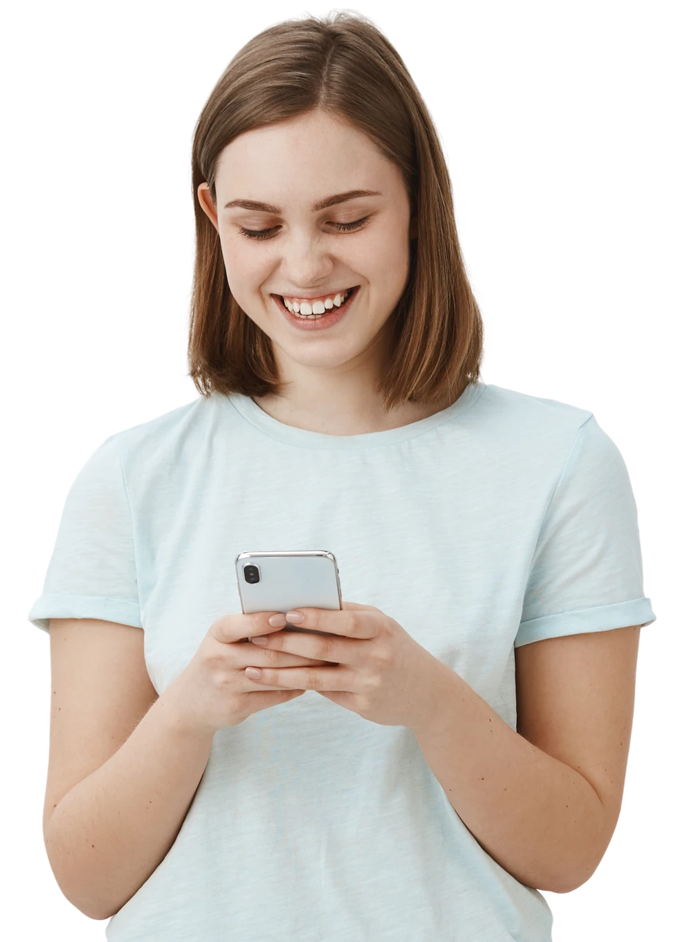 Smiling woman in a pale blue T-shirt typing on her phone